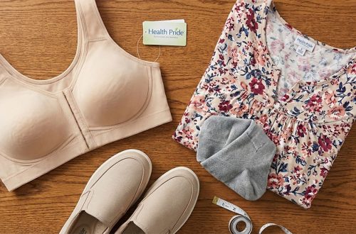 Flatlay of inclusive fashion essentials featuring a front-opening supportive bra, wide-fit comfort shoes, and a floral plus size blouse.